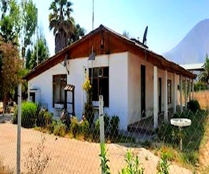 Terreno a orilla del Camino Carampangue, con casa