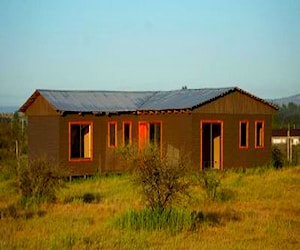 Terreno con casa prefabricada