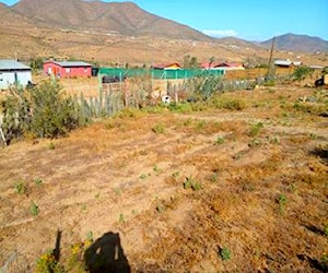 Terreno con tres casas